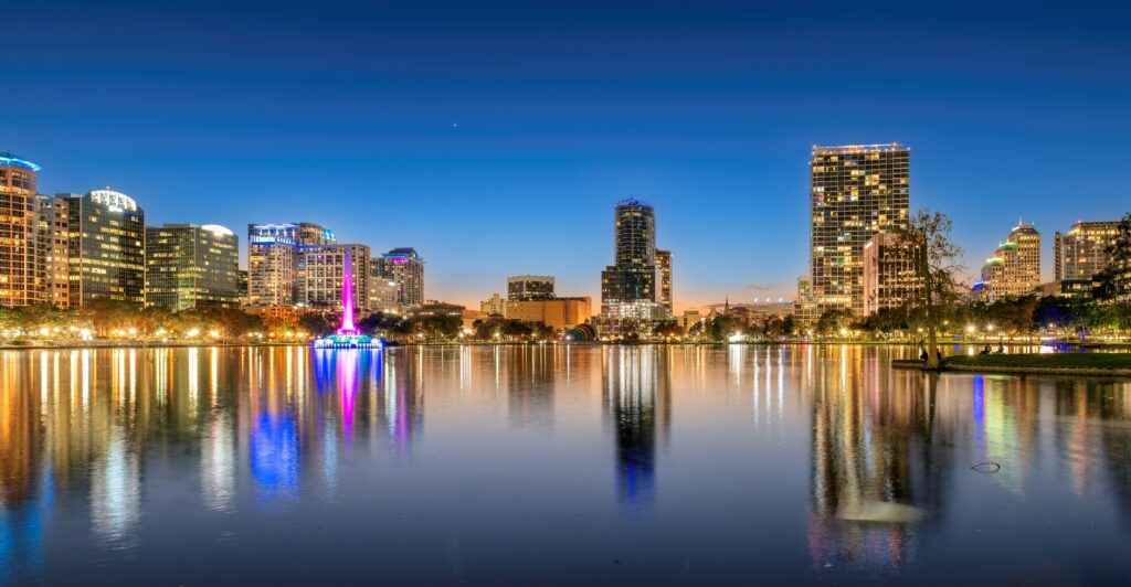 an aerial view of the city of orland at dusk